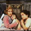 Sarah Jessica Parker as Annie w. orphans in a scene from the Broadway production of the musical "Annie."
