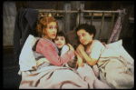 Sarah Jessica Parker as Annie w. orphans in a scene from the Broadway production of the musical "Annie."