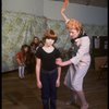 Roseanne Sorrentino as Annie and Patricia Drylie as Miss Hannigan w. orphans during a rehearsal for the Dallas production of the musical "Annie."