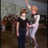 Roseanne Sorrentino as Annie and Patricia Drylie as Miss Hannigan w. orphans during a rehearsal for the Dallas production of the musical "Annie."