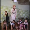 Patricia Drylie as Miss Hannigan w. orphans during a rehearsal for the Dallas production of the musical "Annie."