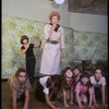 Patricia Drylie as Miss Hannigan w. orphans during a rehearsal for the Dallas production of the musical "Annie."