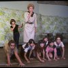 Patricia Drylie as Miss Hannigan w. orphans during a rehearsal for the Dallas production of the musical "Annie."