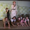 Patricia Drylie as Miss Hannigan w. orphans during a rehearsal for the Dallas production of the musical "Annie."