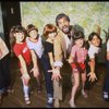 Roseanne Sorrentino as Annie (4L) w. choreographer Peter Gennaro and orphans during a rehearsal for the Dallas production of the musical "Annie."