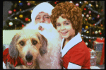 Actress Roseanne Sorrentino as Annie w. Sandy and Santa Claus in a scene from the Dallas production of musical "Annie."