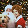 Actress Roseanne Sorrentino as Annie w. Sandy and Santa Claus in a scene from the Dallas production of musical "Annie."