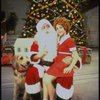 Actress Roseanne Sorrentino as Annie w. Sandy and Santa Claus in a scene from the Dallas production of musical "Annie."