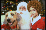 Actress Roseanne Sorrentino as Annie w. Sandy and Santa Claus in a scene from the Dallas production of musical "Annie."