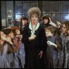 Actress Patricia Drylie as Miss Hannigan w. orphans in a scene from the Dallas production of musical "Annie."