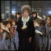Actress Patricia Drylie as Miss Hannigan w. orphans in a scene from the Dallas production of musical "Annie."