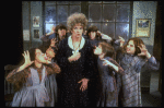 Actress Patricia Drylie as Miss Hannigan w. orphans in a scene from the Dallas production of musical "Annie."