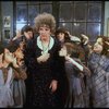 Actress Patricia Drylie as Miss Hannigan w. orphans in a scene from the Dallas production of musical "Annie."