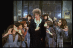 Actress Patricia Drylie as Miss Hannigan w. orphans in a scene from the Dallas production of musical "Annie."
