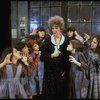 Actress Patricia Drylie as Miss Hannigan w. orphans in a scene from the Dallas production of musical "Annie."