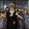 Actress Patricia Drylie as Miss Hannigan w. orphans in a scene from the Dallas production of musical "Annie."