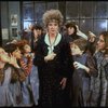Actress Patricia Drylie as Miss Hannigan w. orphans in a scene from the Dallas production of musical "Annie."