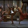 L-R) Katharine Buffaloe as Lily, Michael Leeds as Rooster and Patricia Drylie as Miss Hannigan in a scene from the Dallas production of musical "Annie."