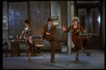 L-R) Katharine Buffaloe as Lily, Michael Leeds as Rooster and Patricia Drylie as Miss Hannigan in a scene from the Dallas production of musical "Annie."