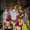 Roseanne Sorrentino as Annie w. Sandy, Santa Claus and orphans in a scene from the Dallas production of musical "Annie." 
