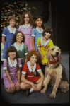 Roseanne Sorrentino as Annie w. Sandy and orphans in a scene from the Dallas production of musical "Annie."