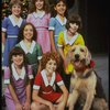 Roseanne Sorrentino as Annie w. Sandy and orphans in a scene from the Dallas production of musical "Annie."