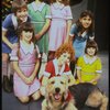 Roseanne Sorrentino as Annie w. Sandy and orphans in a scene from the Dallas production of musical "Annie."