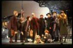 Roseanne Sorrentino as Annie w. Sandy and Hooverville-ites in a scene from the Dallas production of musical "Annie."