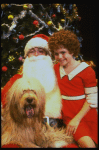 Mary K. Lombardi as Annie w. Santa Claus and Sandy in a scene from the Chicago production of the musical "Annie."