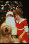 Mary K. Lombardi as Annie w. Santa Claus and Sandy in a scene from the Chicago production of the musical "Annie."