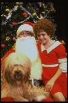 Mary K. Lombardi as Annie w. Santa Claus and Sandy in a scene from the Chicago production of the musical "Annie."