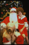 Mary K. Lombardi as Annie w. Santa Claus and Sandy in a scene from the Chicago production of the musical "Annie."