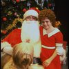 Mary K. Lombardi as Annie w. Santa Claus and Sandy in a scene from the Chicago production of the musical "Annie."