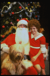 Mary K. Lombardi as Annie w. Santa Claus and Sandy in a scene from the Chicago production of the musical "Annie."