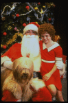 Mary K. Lombardi as Annie w. Santa Claus and Sandy in a scene from the Chicago production of the musical "Annie."