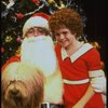 Mary K. Lombardi as Annie w. Santa Claus and Sandy in a scene from the Chicago production of the musical "Annie."