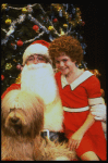 Mary K. Lombardi as Annie w. Santa Claus and Sandy in a scene from the Chicago production of the musical "Annie."