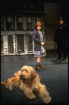 Mary K. Lombardi as Annie w. Sandy and a policeman in a scene from the Chicago production of the musical "Annie."