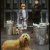 Mary K. Lombardi as Annie w. Sandy and a policeman in a scene from the Chicago production of the musical "Annie."