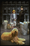 Mary K. Lombardi as Annie w. Sandy and a policeman in a scene from the Chicago production of the musical "Annie."