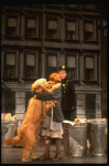 Mary K. Lombardi as Annie w. Sandy and a policeman in a scene from the Chicago production of the musical "Annie."