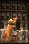 Mary K. Lombardi as Annie w. Sandy and a policeman in a scene from the Chicago production of the musical "Annie."