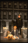 Mary K. Lombardi as Annie w. Sandy and a policeman in a scene from the Chicago production of the musical "Annie."