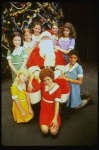 Mary K. Lombardi as Annie w. Santa Claus and orphans in a scene from the Chicago production of the musical "Annie."