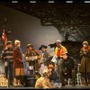 Mary K. Lombardi as Annie w. Sandy and Hooverville-ites in a scene from the Chicago production of the musical "Annie."