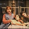 Actress Mary K. Lombardi as Annie (L) w. orphans in a scene from the Chicago production of the musical "Annie."