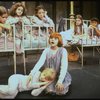 Actress Mary K. Lombardi as Annie (C) w. orphans in a scene from the Chicago production of the musical "Annie."