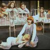 Actress Mary K. Lombardi as Annie (C) w. orphans in a scene from the Chicago production of the musical "Annie."