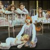 Actress Mary K. Lombardi as Annie (C) w. orphans in a scene from the Chicago production of the musical "Annie."