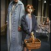 Mary K. Lombardi as Annie and Ruth Kobart as Miss Hannigan w. orphans in a scene from the Chicago production of the musical "Annie."